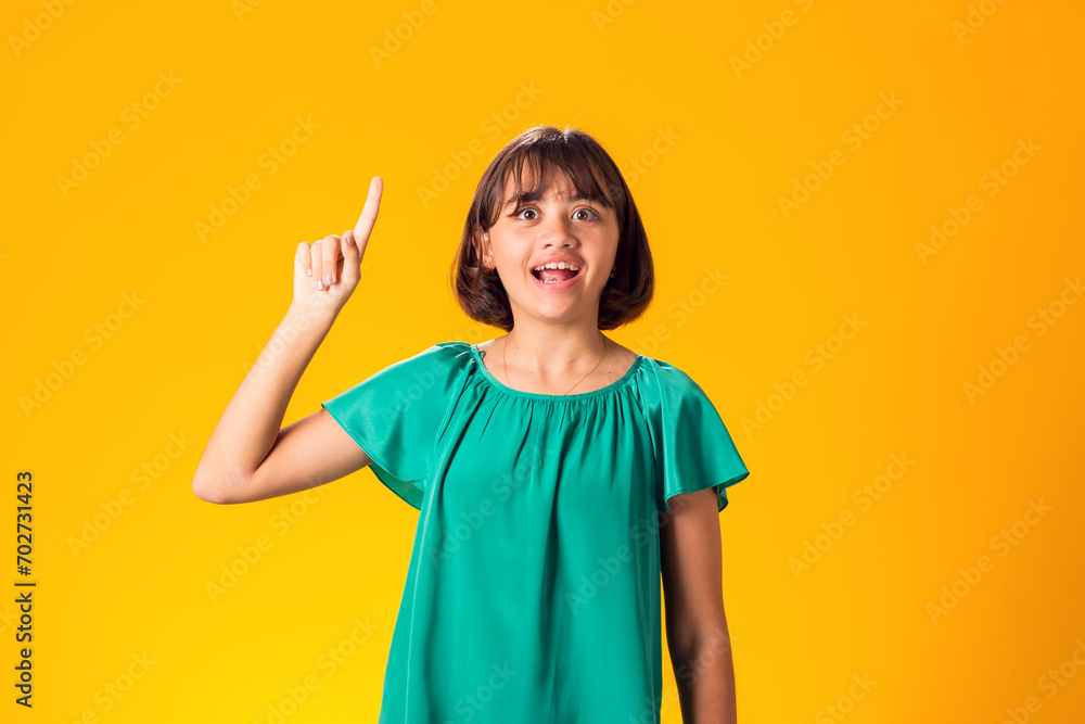 Smiling kid girl over yellow background. Emotion concept Smiling kid girl over yellow background. Emotion concept