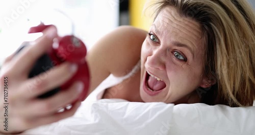 Oversleeping at work and screaming woman at alarm clock. I wake up feeling anxious and late
