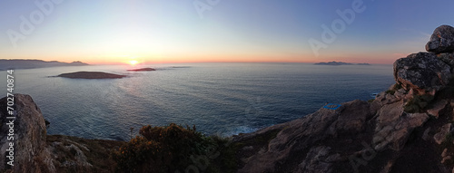 Panoramic view from the compass rose viewpoint in Monteferro of the Cies Islands, the Estelas Islands and Baiona at sunset. Nigran - Spain