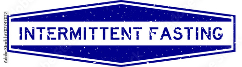 Grunge blue intermittent fasting word hexagon rubber seal stamp on white background