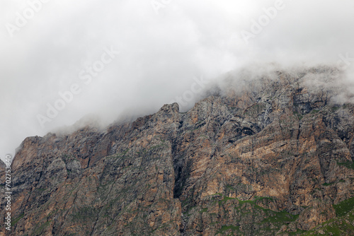 majestic Caucasus mountains drowning in clouds