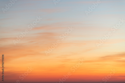 Sky gradient from blue to orange sunset © EKKAPON