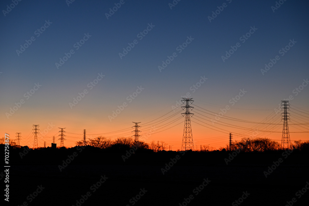 Towers of power line in magic hour 