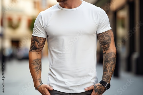Modern man with a tattoo walking along the street in a white tee shirt mockup
