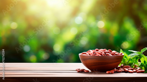 Goji berries harvest in a bowl on a garden background. Selective focus. photo