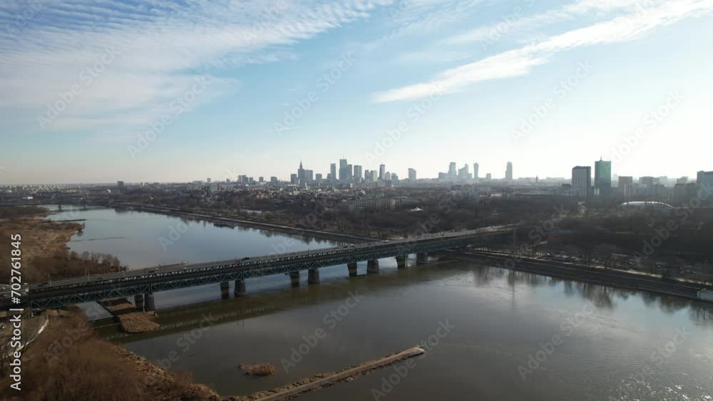 From a drone's perspective, the Vistula River in Warsaw unveils its scenic beauty, winding through the cityscape. This aerial view captures the majesty of the river From a drone's perspective, the Vistula River in Warsaw unveils its scenic beauty, winding through the cityscape. This aerial view captures the majesty of the river