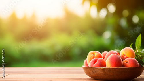 Peaches in a bowl in the garden. Selective focus.