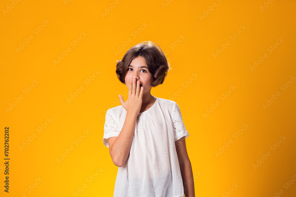 Surprised kid girl over yellow background. Astonishment concept Surprised kid girl over yellow background. Astonishment concept