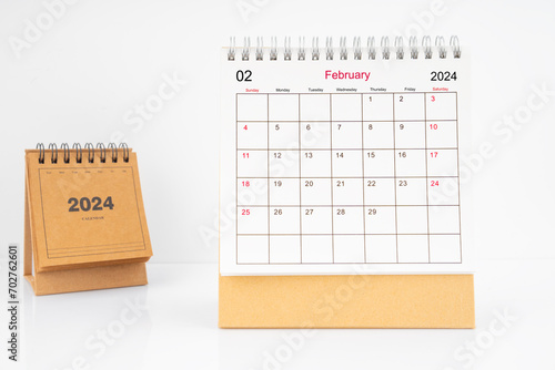 Monthly desk calendar February 2024 year on white table.