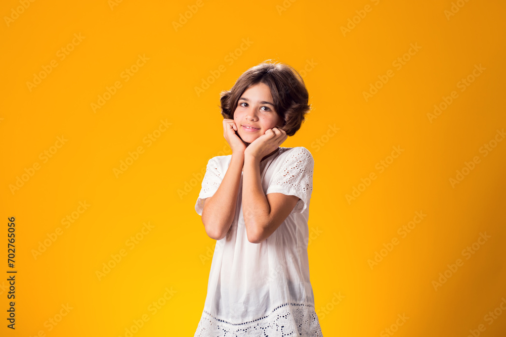 Smiling kid girl over yellow background. Emotion concept Smiling kid girl over yellow background. Emotion concept