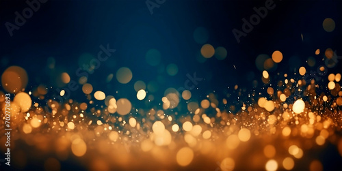 Dark blue gradient background with stars and circles in gold color in bokeh effect.Glitter luxury gold. The background for the holiday. photo