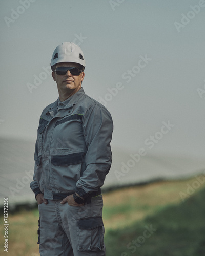 Portrait of an electrician among solar panels