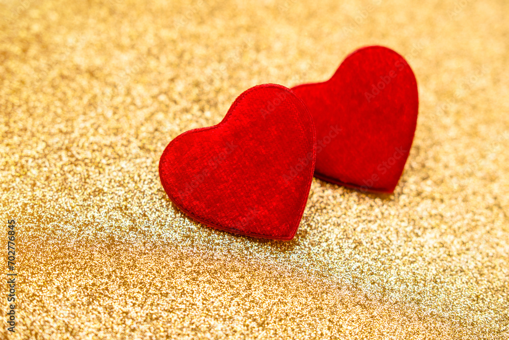 Fototapeta premium Heart symbol on a gold shiny background 