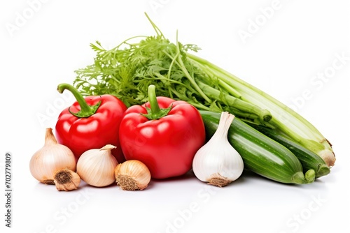  a group of vegetables sitting next to each other on top of a white surface with a few bulbs of garlic next to them.