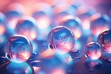  a group of glass balls sitting on top of a blue and pink table top next to a pile of other glass balls.
