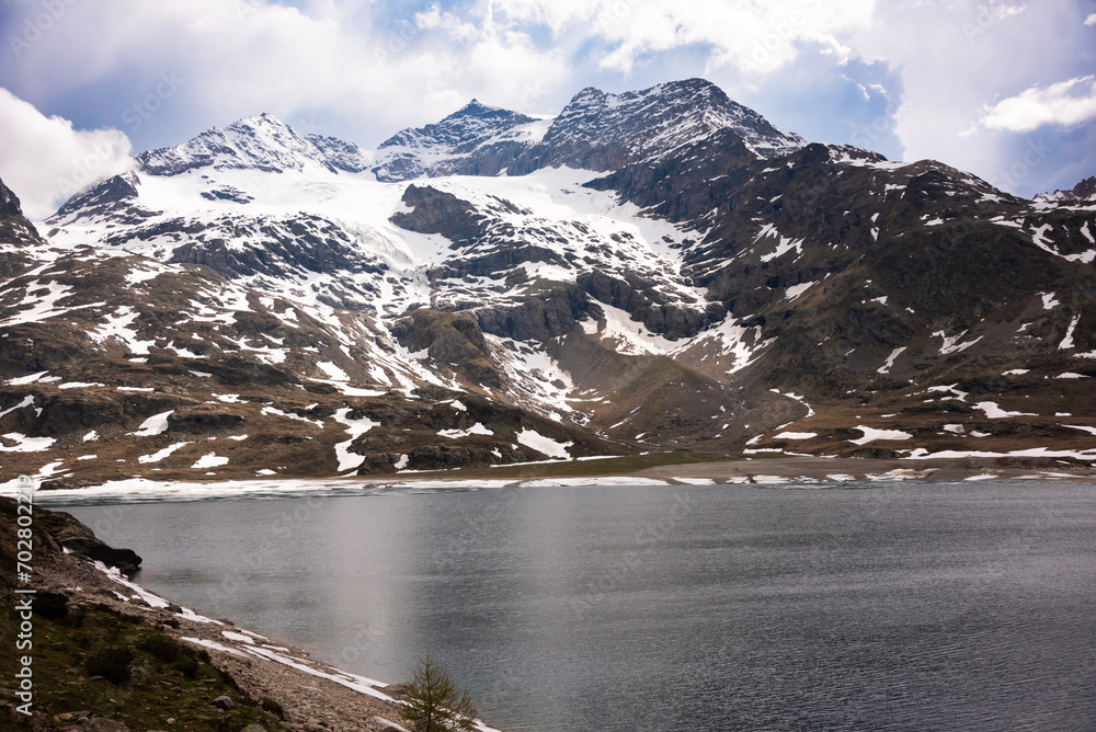 Mountain lake with ice in Switzerland in spring