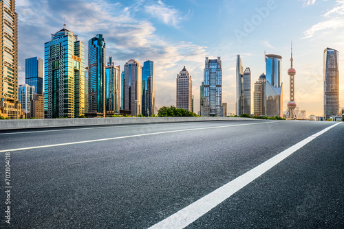 Empty asphalt road and city buildings skyline in Shanghai