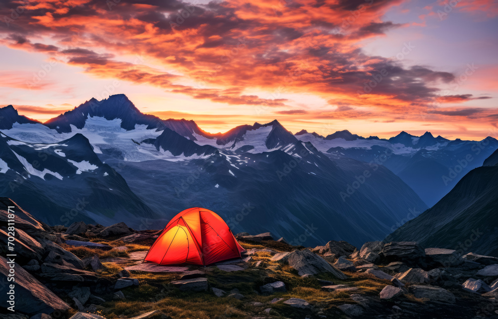 Sunset glow over campsite in rugged mountains