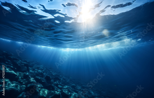 Sunlight piercing through the sea surface, underwater serenity