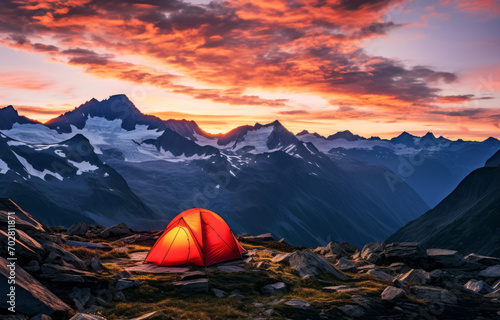Sunset glow over campsite in rugged mountains
