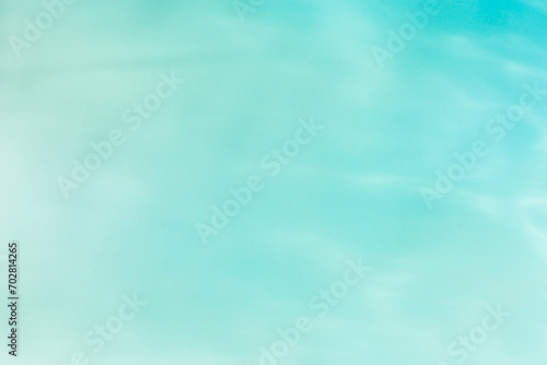 Defocused abstract background seawater gradient color, blue, turquoise, green, mint colors. Different tints sea water as blurred wallpaper, fon, backdrop, design elements. Pastel colored summer tones