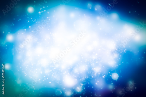 white flake flare blur abstract on blue background. snow bokeh christmas blurred beautiful shiny Christmas lights.