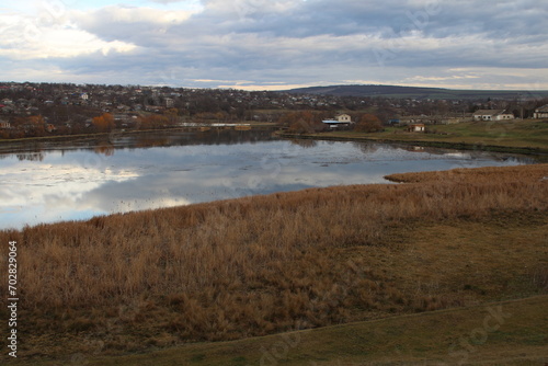 A body of water with a land in the background