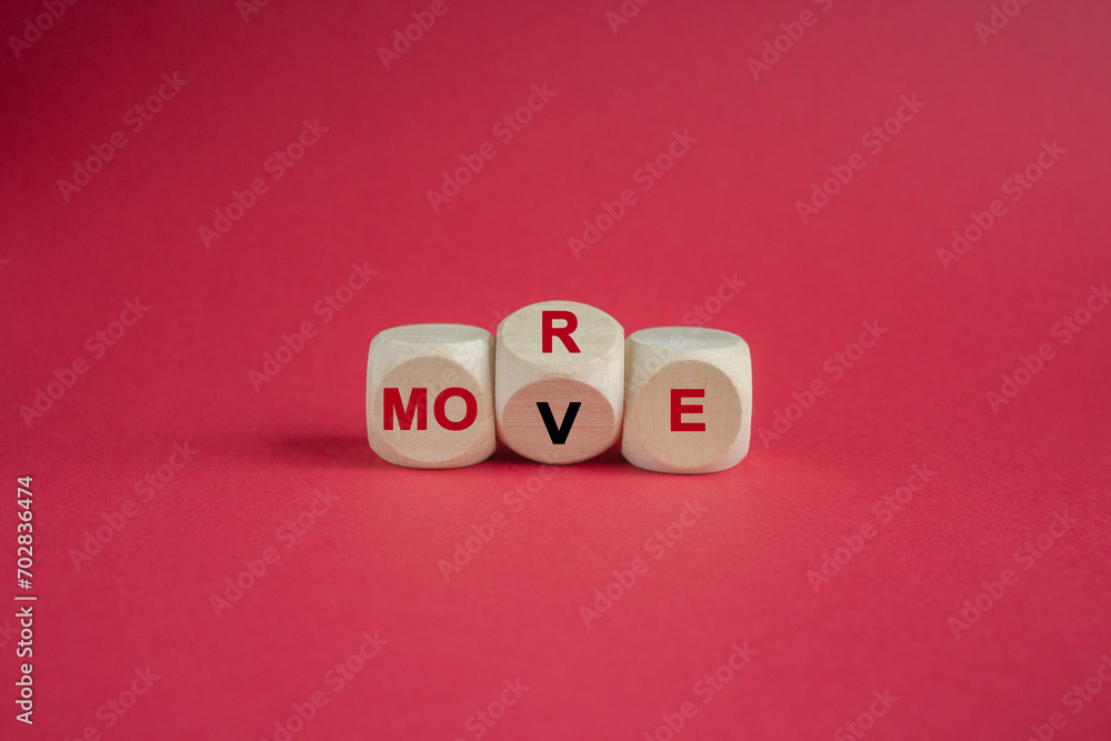 More move. Concept red word More move on wooden cubes. Beautiful red background. Business and more move concept. Copy space. More move. Concept red word More move on wooden cubes. Beautiful red background. Business and more move concept. Copy space.