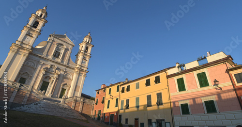 The Basilica of Santo Stefano in Lavagna is a masterpiece of marble, balustrades, stairways, churchyards and lions among the colorful gloomy houses of Piazza Marconi
