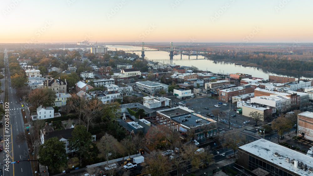Aerial view of downtown Wilmington during sunrise with the Cape Fear Memorial Bridge in the background.