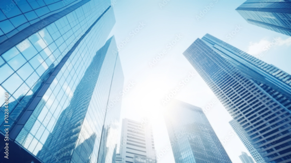 Modern office building with blue sky, and glass facades. Economy, finances, business activity concept, Eco-friendly building in the city, blurred image