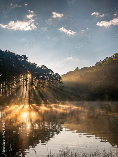 landscape with fog in the morning,View of foggy on the lagoon in front of sunset,morning fog in the lake view.