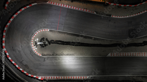 Aerial top view race kart track at night, Track for auto racing top view, Car race asphalt and curve street circuit, Aerial view asphalt race track at night. photo