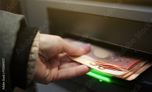 Girl get from cash machine euro money