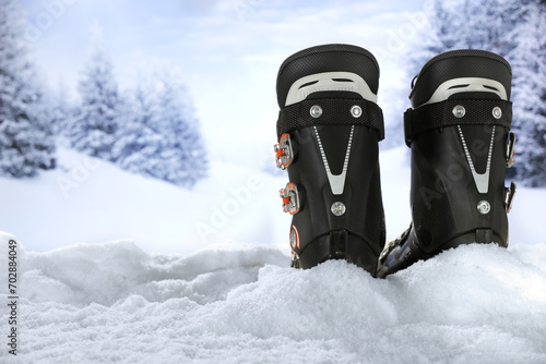 Ski boots on snow and winter time.  photo