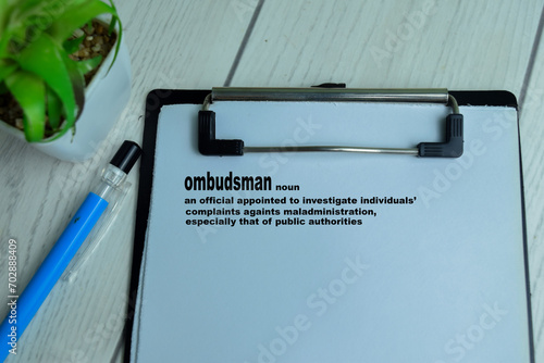 Foto Concept of Definition of Ombudsman write on paperwork with a meaning isolated on wooden background
