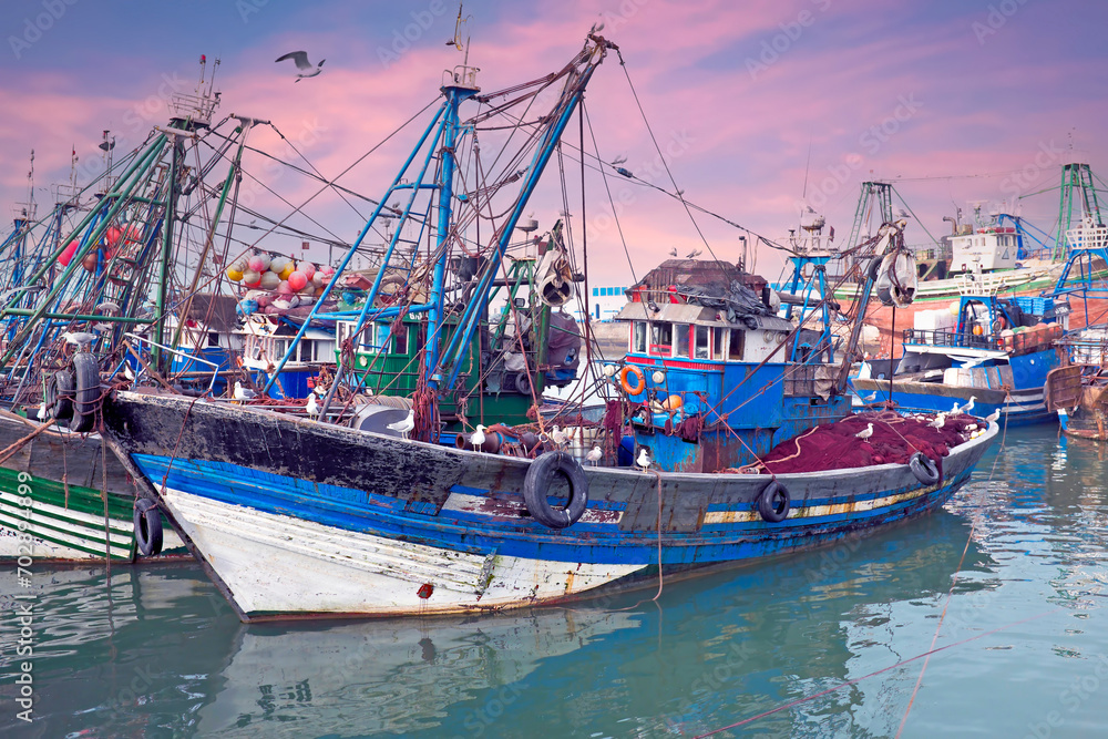 Fishing boats at the harbor from Essaouria. Essaouria is the most popular Atlantic coast city in Morocco Africa at sunset.