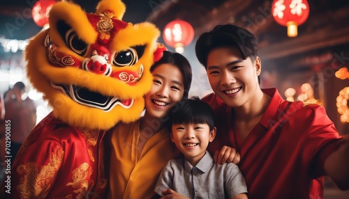 Chinese family taking selfie with a lion dance background
