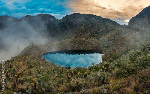 Lake or lagoon in the colombian paramo andean ecosystem. Landscape with frailejon, cloudy and colorful sky. Lake and hotsprings in Murillo, Tolima, Colombia