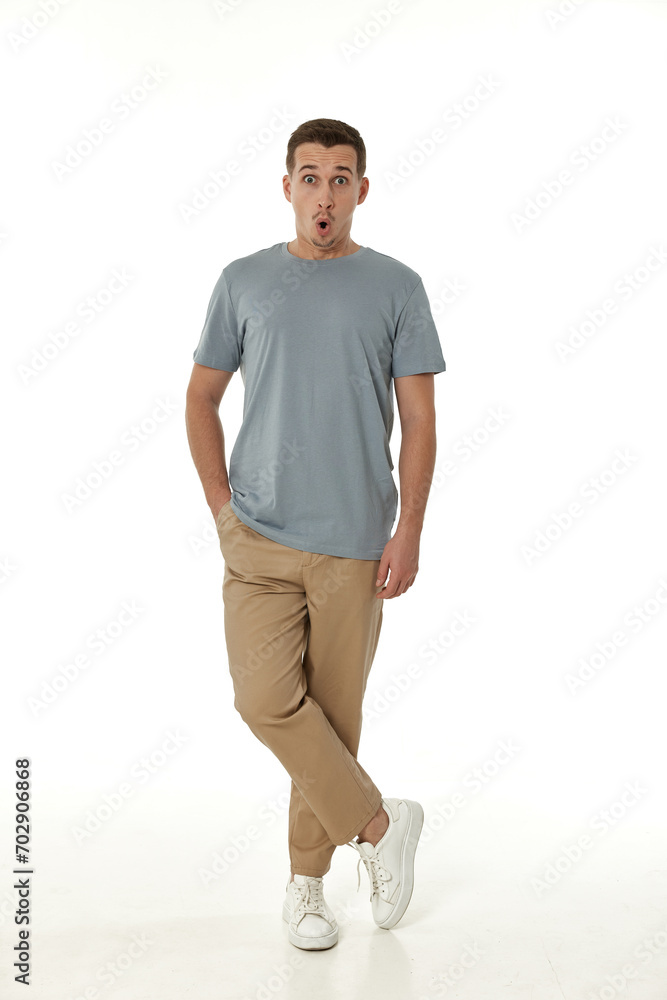 surprised guy looking at camera on white studio background surprised guy looking at camera on white studio background