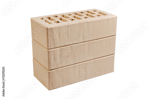 Stack of three clay bricks against white background