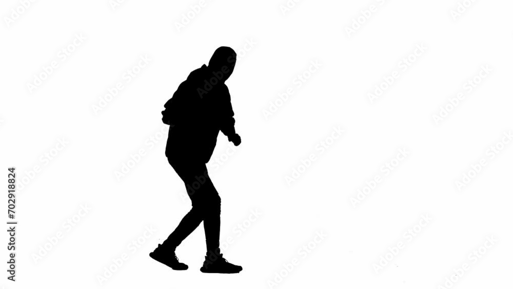 Black silhouette of thief on isolated white background. A male robber in a hoodie and balaclava is walking with a metal crowbar in his hands. Concept of crime and thievery. Side view. Black silhouette of thief on isolated white background. A male robber in a hoodie and balaclava is walking with a metal crowbar in his hands. Concept of crime and thievery. Side view.
