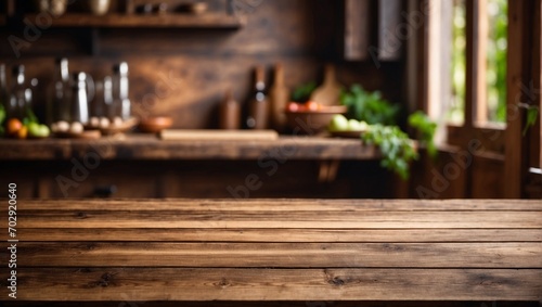 Kitchen background with an empty brown wooden table. Cooking supplies  decorations. Wallpaper with an free space. Rays of light. Daylight.