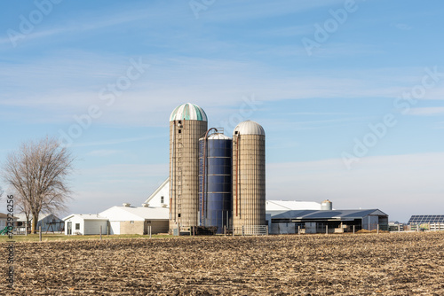 Old farm buildings, including grain silos and barns, in rural Livingston county.  Illinois, USA. photo