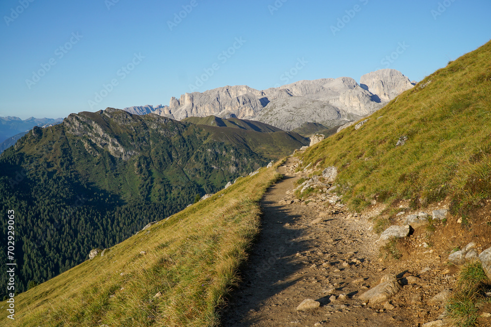 Wonderful and idyllic hiking trail in the italian dolomites in South Tyrol. View to Rosengarten Schlern Naturepark. Hiking at Sassolungo and Sassopiatto mountains