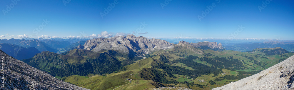 Awesome panoramic mountain scenery in the dolomites: View from Sassopiatto peak to Rosengarten Schlern Naturepark, Alpe di Siusi and Rosszahnscharte in Gardena Valley, South Tyrol