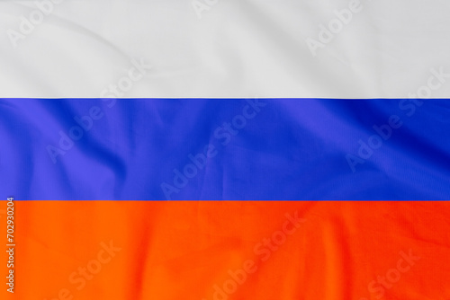 Flag of Russia (Russian Federation) with natural material creases as a background