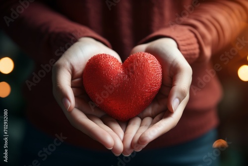 Heart in hands. Background with selective focus and copy space