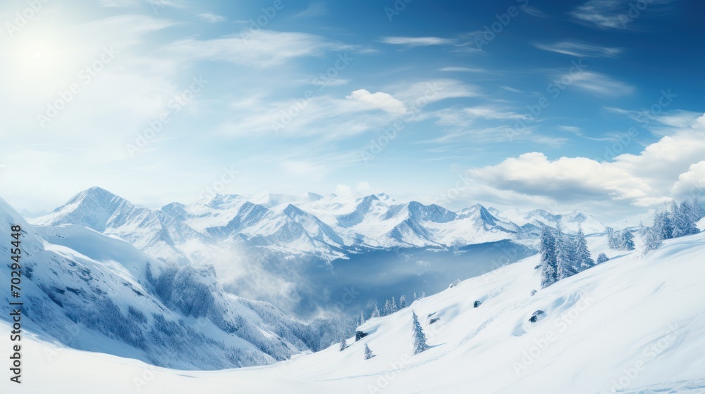 Fototapeta premium The picturesque mountains were covered in a layer of pristine white snow with soft sunlight.