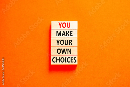 You make your own choice symbol. Concept words You make your own choice on wooden blocks. Beautiful orange table orange background. Business you make your own choice concept. Copy space.